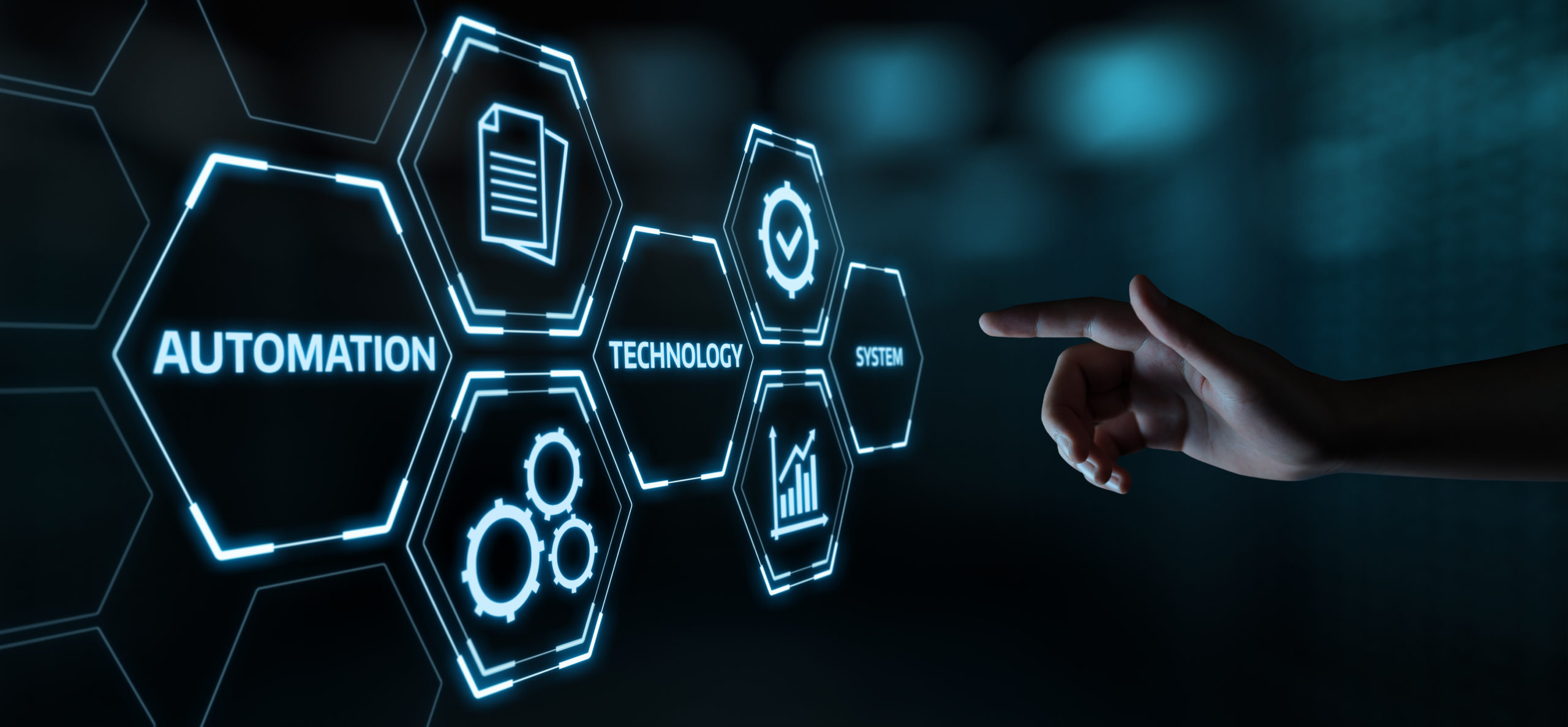 7 illuminated hexagons arranged to the left with automation, technology, and system written on it, while a hand points to it